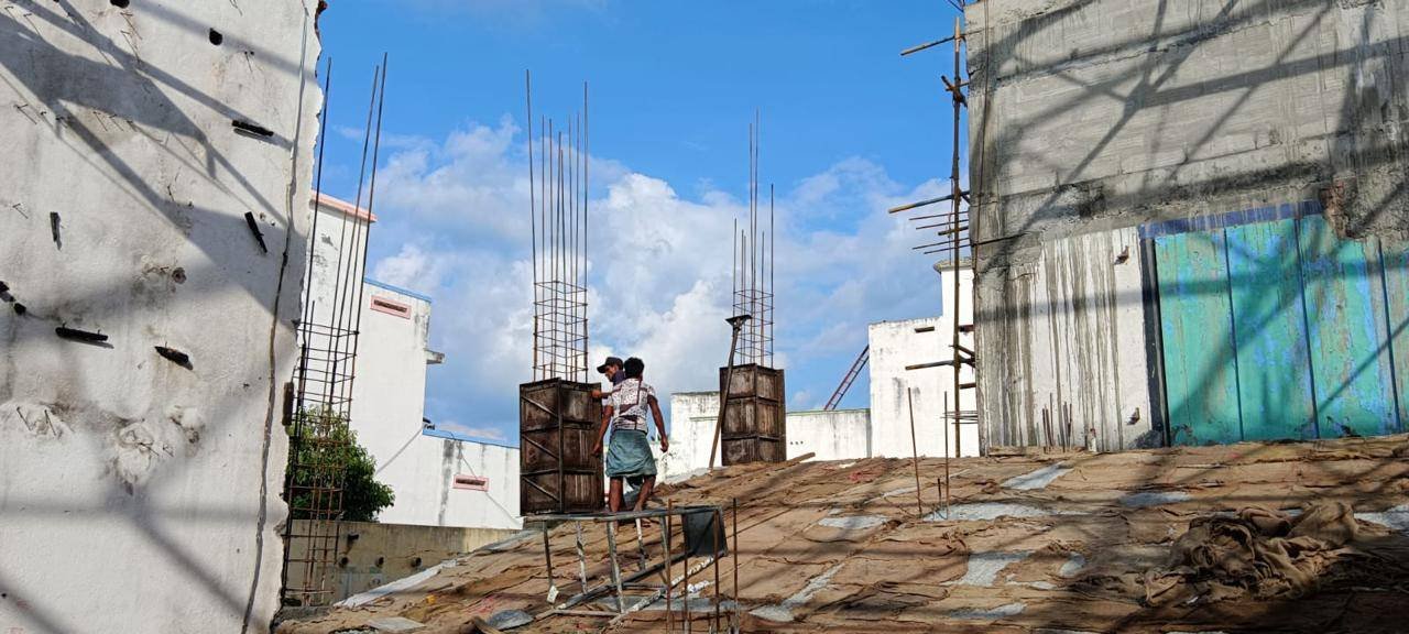 Real-time on-site work showing foundation and structural frame construction